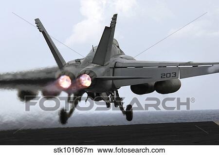 Picture - An F/A-18E Super Hornet launches off the flight deck of USS Kitty Hawk.. Fotosearch