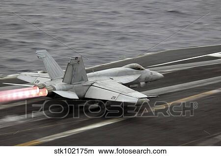 An F/A-18E Super Hornet launches off the flight deck of USS Ronald Reagan. View Large Photo Image Picture - An F/A-18E Super Hornet launches off the flight deck of USS Ronald Reagan.. Fotosearch