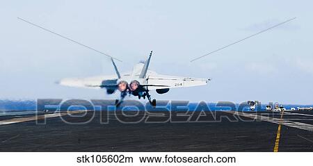 An F/A-18E Super Hornet launches off the flight deck of USS John C. Stennis. View Large Photo Image Picture - An F/A-18E Super Hornet launches off the flight deck of USS John C. Stennis.. Fotosearch