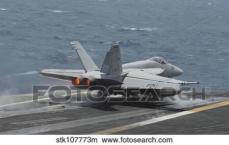 An F/A-18E Super Hornet launches off the flight deck of USS Nimitz. View Large Photo Image Picture - An F/A-18E Super Hornet launches off the flight deck of USS Nimitz.. Fotosearch