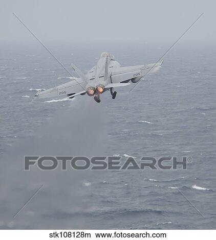 An F/A-18E Super Hornet launches off the flight deck of USS Nimitz. View Large Photo Image Picture - An F/A-18E Super Hornet launches off the flight deck of USS Nimitz.. Fotosearch