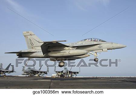 An F/A-18E Super Hornet makes an arrested landing aboard an aircraft carrier. View Large Photo Image Picture - An F/A-18E Super Hornet makes an arrested landing aboard an aircraft carrier.. Fotosearch