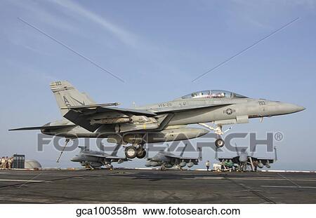 An F/A-18E Super Hornet makes an arrested landing aboard an aircraft carrier. View Large Photo Image Picture - An F/A-18E Super Hornet makes an arrested landing aboard an aircraft carrier.. Fotosearch