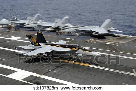 An F/A-18E Super Hornet makes an arrested landing. View Large Photo Image Picture - An F/A-18E Super Hornet makes an arrested landing.. Fotosearch