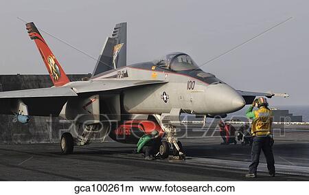 Picture - An F/A-18E Super Hornet moving to the catapult aboard USS George H. W. Bush.. Fotosearch