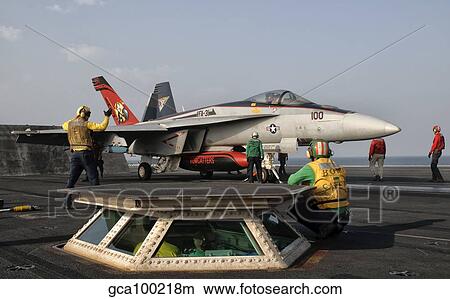 An F/A-18E Super Hornet on the flight deck of USS George H. W. Bush. View Large Photo Image Picture - An F/A-18E Super Hornet on the flight deck of USS George H. W. Bush.. Fotosearch