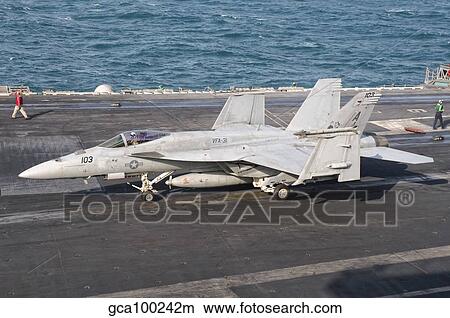 An F/A-18E Super Hornet on the flight deck of USS George H. W. Bush. View Large Photo Image Picture - An F/A-18E Super Hornet on the flight deck of USS George H. W. Bush.. Fotosearch