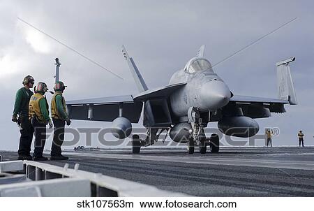 An F/A-18E Super Hornet on the flight deck of USS Carl Vinson. View Large Photo Image Picture - An F/A-18E Super Hornet on the flight deck of USS Carl Vinson.. Fotosearch