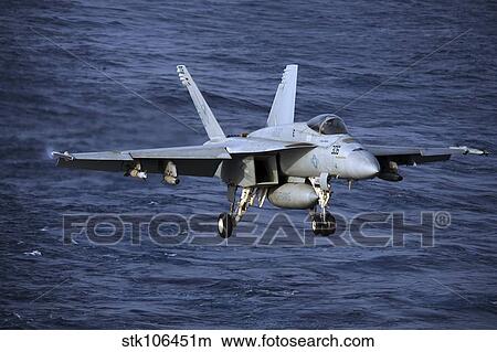 An F/A-18E Super Hornet prepares to make an arrested landing. View Large Photo Image Picture - An F/A-18E Super Hornet prepares to make an arrested landing.. Fotosearch