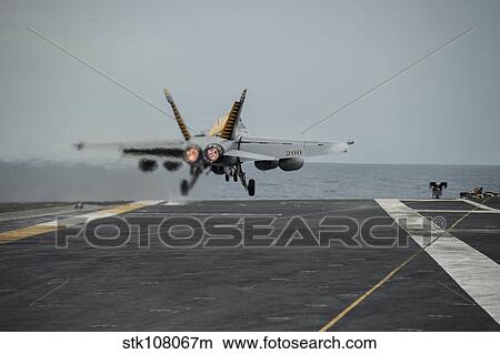 An F/A-18E Super Hornet takes off from the flight deck of USS George Washington. View Large Photo Image Picture - An F/A-18E Super Hornet takes off from the flight deck of USS George Washington.. Fotosearch