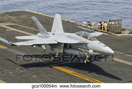 Picture - An F/A-18E Super Hornet trap landing on the flight deck of USS Harry S. Truman. Fotosearch