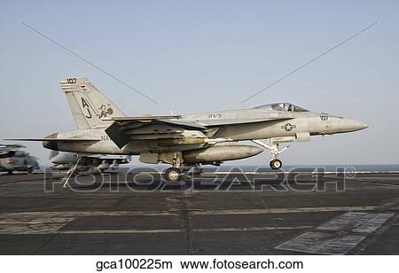 An F/A-18E Super Hornet trap landing aboard USS George H. W. Bush. View Large Photo Image Picture - An F/A-18E Super Hornet trap landing aboard USS George H. W. Bush.. Fotosearch