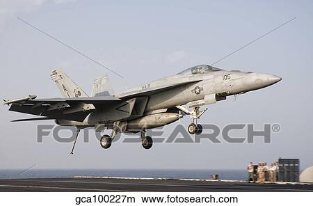 An F/A-18E Super Hornet trap landing aboard USS George H. W. Bush. View Large Photo Image Picture - An F/A-18E Super Hornet trap landing aboard USS George H. W. Bush.. Fotosearch