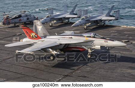 An F/A-18E Super Hornet trap landing aboard USS George H. W. Bush. View Large Photo Image Picture - An F/A-18E Super Hornet trap landing aboard USS George H. W. Bush.. Fotosearch