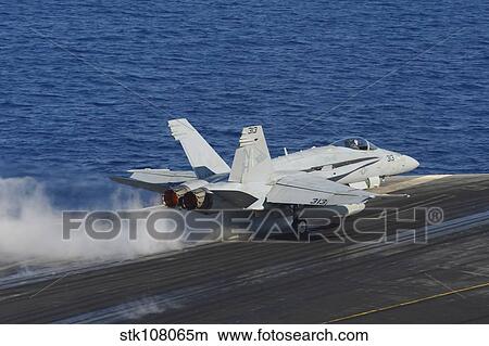 An F/A-18F Hornet launches from the flight deck of USS Nimitz. View Large Photo Image Picture - An F/A-18F Hornet launches from the flight deck of USS Nimitz.. Fotosearch
