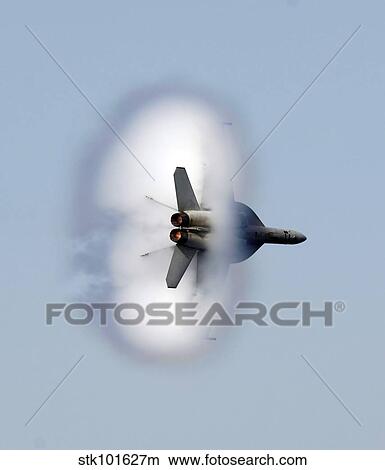 An F/A-18F Super Hornet completes a super-sonic flyby. View Large Photo Image Picture - An F/A-18F Super Hornet completes a super-sonic flyby.. Fotosearch