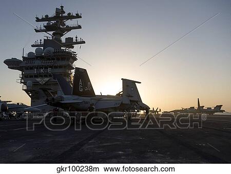 An F/A-18F Super Hornet is inspected aboard USS Dwight D. Eisenhower. View Large Photo Image Picture - An F/A-18F Super Hornet is inspected aboard USS Dwight D. Eisenhower.. Fotosearch