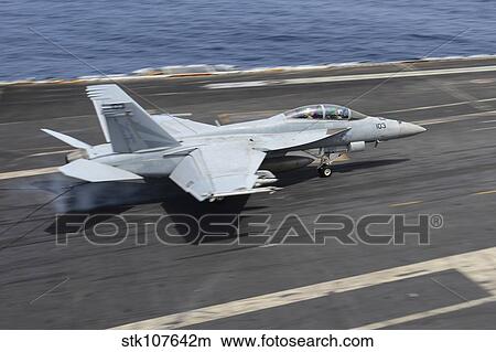 Picture - An F/A-18F Super Hornet lands on the flight deck of USS Nimitz.. Fotosearch
