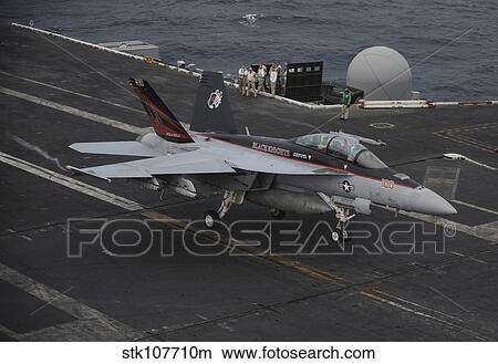 Picture - An F/A-18F Super Hornet lands on the flight deck of USS Nimitz.. Fotosearch
