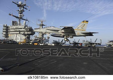 Picture - An F/A-18F Super Hornet lands on the flight deck of USS Harry S. Truman.. Fotosearch