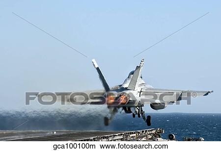 An F/A-18F Super Hornet launches from the flight deck of aircraft carrier USS Nimitz. View Large Photo Image Picture - An F/A-18F Super Hornet launches from the flight deck of aircraft carrier USS Nimitz.. Fotosearch