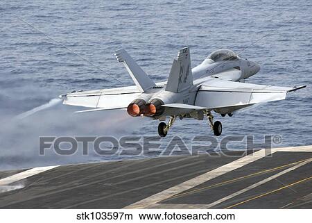 An F/A-18F Super Hornet launches from the aircraft carrier USS Ronald Reagan. View Large Photo Image Picture - An F/A-18F Super Hornet launches from the aircraft carrier USS Ronald Reagan.. Fotosearch