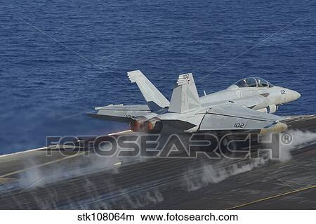 An F/A-18F Super Hornet launches from the flight deck of USS Nimitz. View Large Photo Image Picture - An F/A-18F Super Hornet launches from the flight deck of USS Nimitz.. Fotosearch