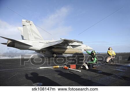 Picture - An F/A-18F Super Hornet launches from USS Nimitz.. Fotosearch