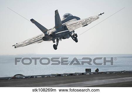 An F/A-18F Super Hornet launches from the flight deck of USS Harry S. Truman. View Large Photo Image Picture - An F/A-18F Super Hornet launches from the flight deck of USS Harry S. Truman.. Fotosearch