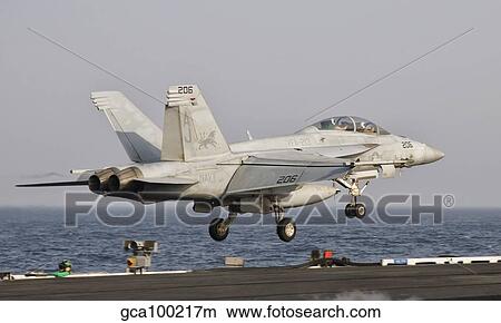 Picture - An F/A-18F Super Hornet launches off the flight deck of USS George H. W. Bush.. Fotosearch