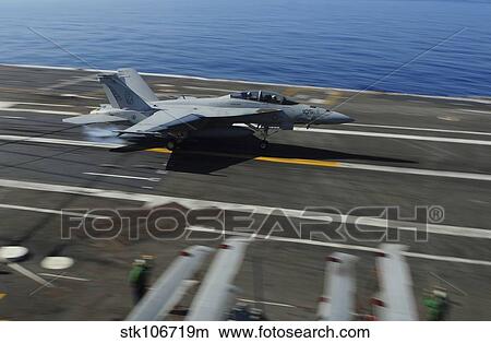 An F/A-18F Super Hornet makes an arrested landing aboard USS George H. W. Bush. View Large Photo Image Picture - An F/A-18F Super Hornet makes an arrested landing aboard USS George H. W. Bush.. Fotosearch