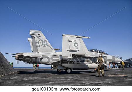 An F/A-18F Super Hornet moves into launch position aboard aircraft carrier USS Nimitz. View Large Photo Image Picture - An F/A-18F Super Hornet moves into launch position aboard aircraft carrier USS Nimitz.. Fotosearch
