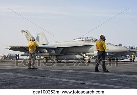 Picture - An F/A-18F Super Hornet on the flight deck of USS Theodore Roosevelt.. Fotosearch
