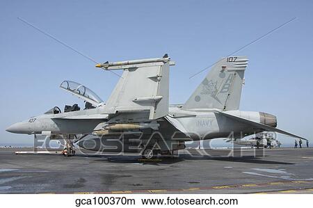 An F/A-18F Super Hornet on the flight deck of USS Theodore Roosevelt. View Large Photo Image Picture - An F/A-18F Super Hornet on the flight deck of USS Theodore Roosevelt.. Fotosearch