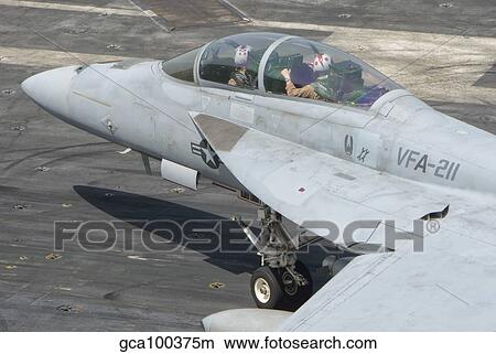 An F/A-18F Super Hornet on the flight deck of USS Theodore Roosevelt. View Large Photo Image Picture - An F/A-18F Super Hornet on the flight deck of USS Theodore Roosevelt.. Fotosearch