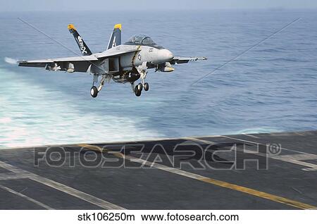 An F/A-18F Super Hornet prepares to land on the flight deck USS Dwight D. Eisenhower. View Large Photo Image Picture - An F/A-18F Super Hornet prepares to land on the flight deck USS Dwight D. Eisenhower.. Fotosearch
