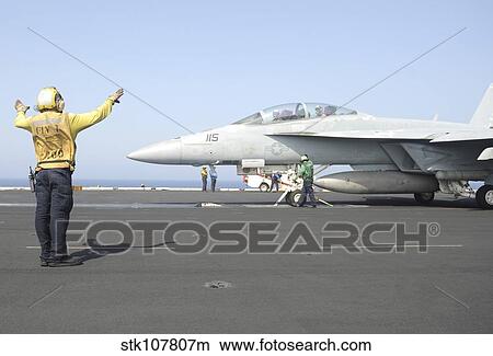 An F/A-18F Super Hornet prepares to launch. View Large Photo Image Picture - An F/A-18F Super Hornet prepares to launch.. Fotosearch