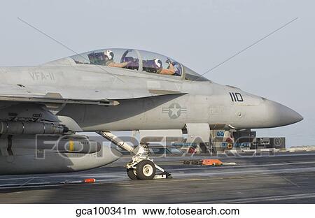 Picture - An F/A-18F Super Hornet ready to launch from a catapult.. Fotosearch