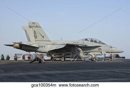 An F/A-18F Super Hornet ready to launch from a catapult. View Large Photo Image Picture - An F/A-18F Super Hornet ready to launch from a catapult.. Fotosearch