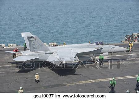 An F/A-18F Super Hornet ready to launch from a catapult aboard USS Theodore Roosevelt. View Large Photo Image Picture - An F/A-18F Super Hornet ready to launch from a catapult aboard USS Theodore Roosevelt.. Fotosearch