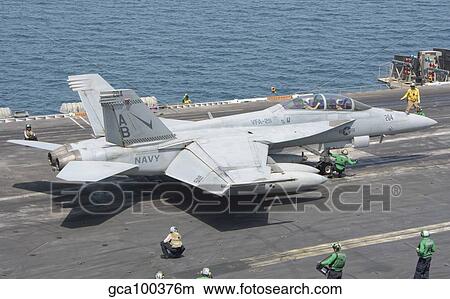An F/A-18F Super Hornet ready to launch from a catapult aboard USS Theodore Roosevelt. View Large Photo Image Picture - An F/A-18F Super Hornet ready to launch from a catapult aboard USS Theodore Roosevelt.. Fotosearch