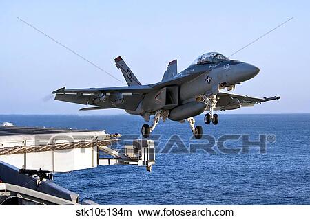 An F/A-18F Super Hornet takes off from the carrier USS John C. Stennis. View Large Photo Image Picture - An F/A-18F Super Hornet takes off from the carrier USS John C. Stennis.. Fotosearch