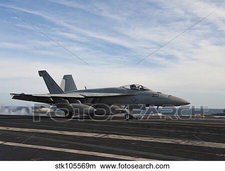 An F/A-18F Super Hornet takes off from the flight deck of USS Enterprise. View Large Photo Image Picture - An F/A-18F Super Hornet takes off from the flight deck of USS Enterprise.. Fotosearch