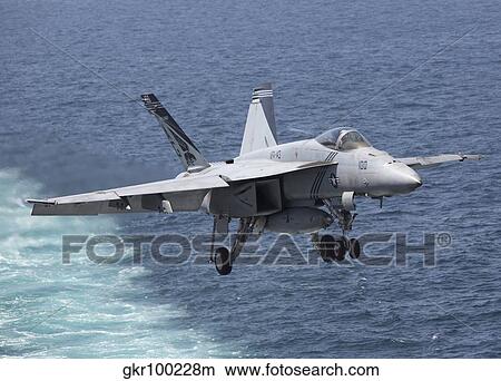 An F/A-18F Super Hornet takes off during flight operations in the Arabian Sea. View Large Photo Image Picture - An F/A-18F Super Hornet takes off during flight operations in the Arabian Sea.. Fotosearch