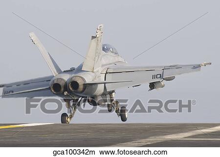 An F/A-18F Super Hornet taking off from the flight deck. View Large Photo Image Picture - An F/A-18F Super Hornet taking off from the flight deck.. Fotosearch