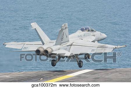 Picture - An F/A-18F Super Hornet taking off from the flight deck.. Fotosearch