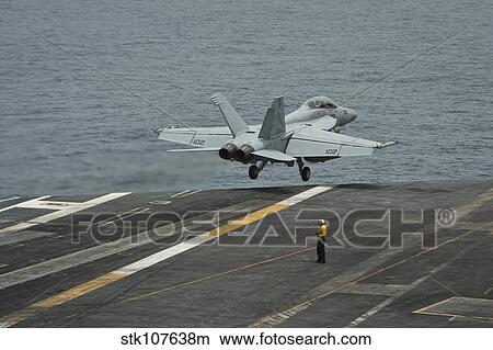 An F/A-18F Super Hornet taking off from USS Nimitz. View Large Photo Image Picture - An F/A-18F Super Hornet taking off from USS Nimitz.. Fotosearch