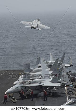 Picture - An F/A-18F Super Hornet taking off from USS Nimitz.. Fotosearch