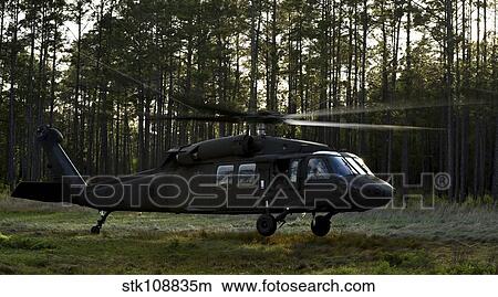 Picture - An HH-60 Pave Hawk evacuates injured patients.. Fotosearch