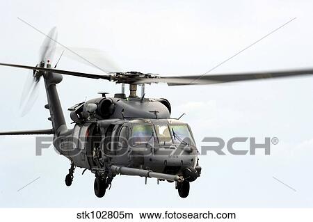 An HH-60 Pave Hawk helicopter conducts search and rescue operations. View Large Photo Image Picture - An HH-60 Pave Hawk helicopter conducts search and rescue operations.. Fotosearch